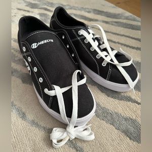 NEVER WORN Heelys with wheels Men’s 7 / Women’s 8.5 black/white